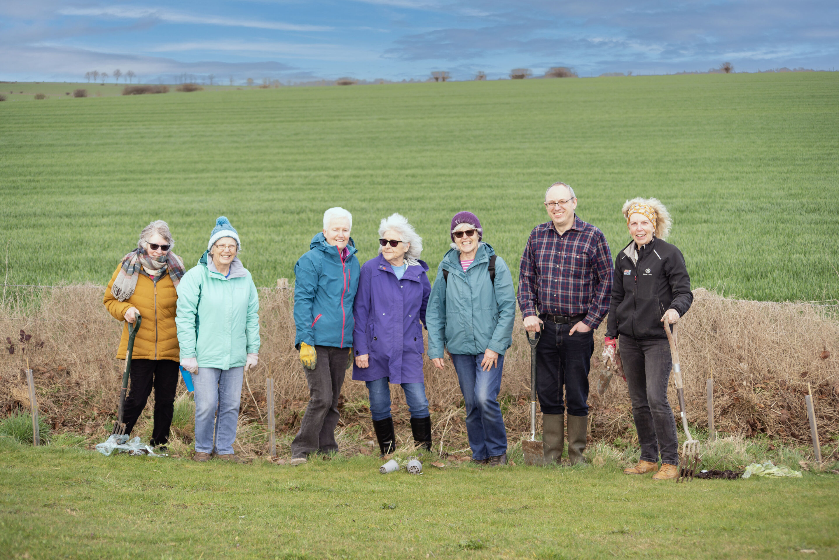 Cllr Baker planting trees with members of New Sarum WI at Norman Drive
