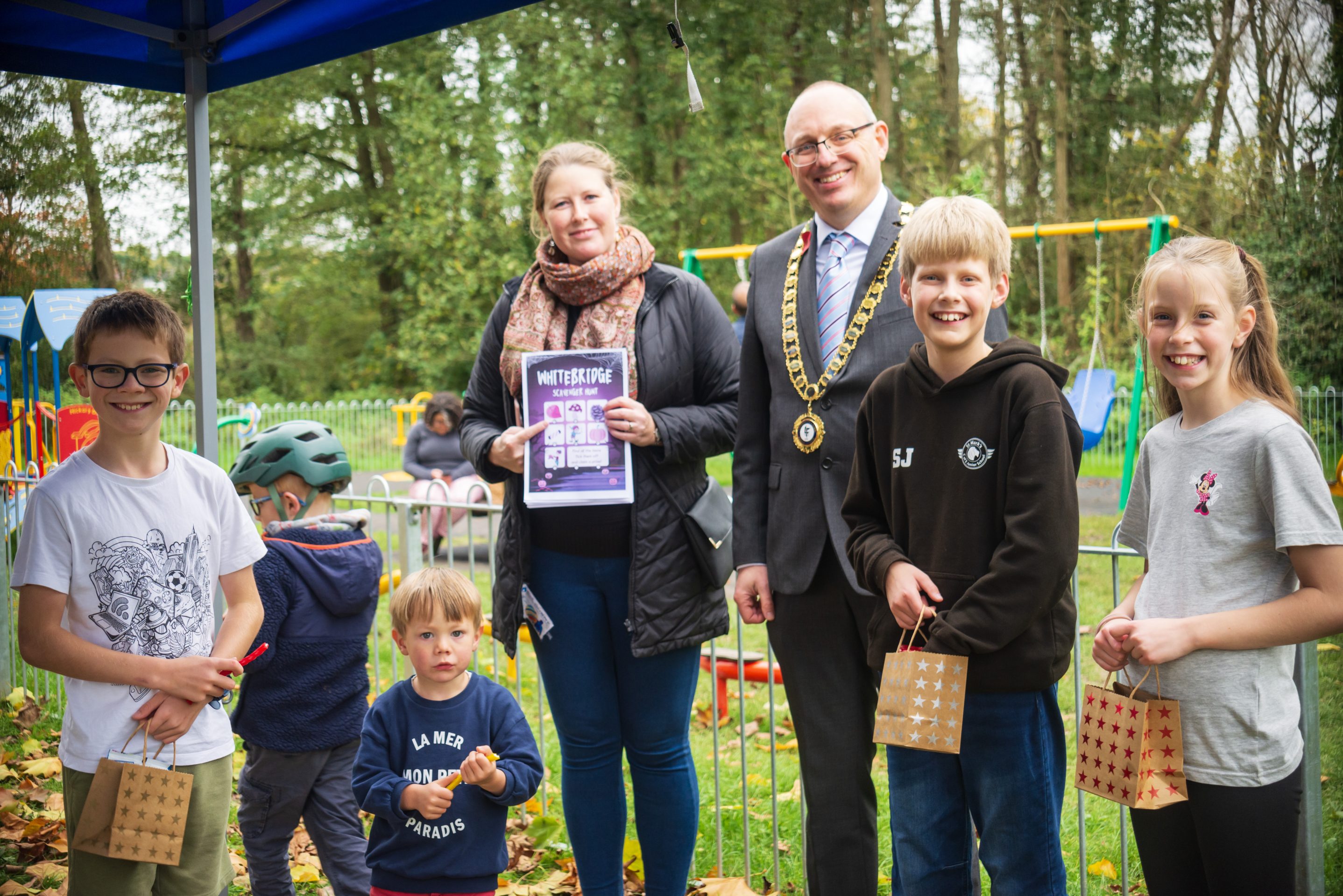 Cllrs Jones and Baker hand out prizes for successfully completed Quests and Treasure Hunts