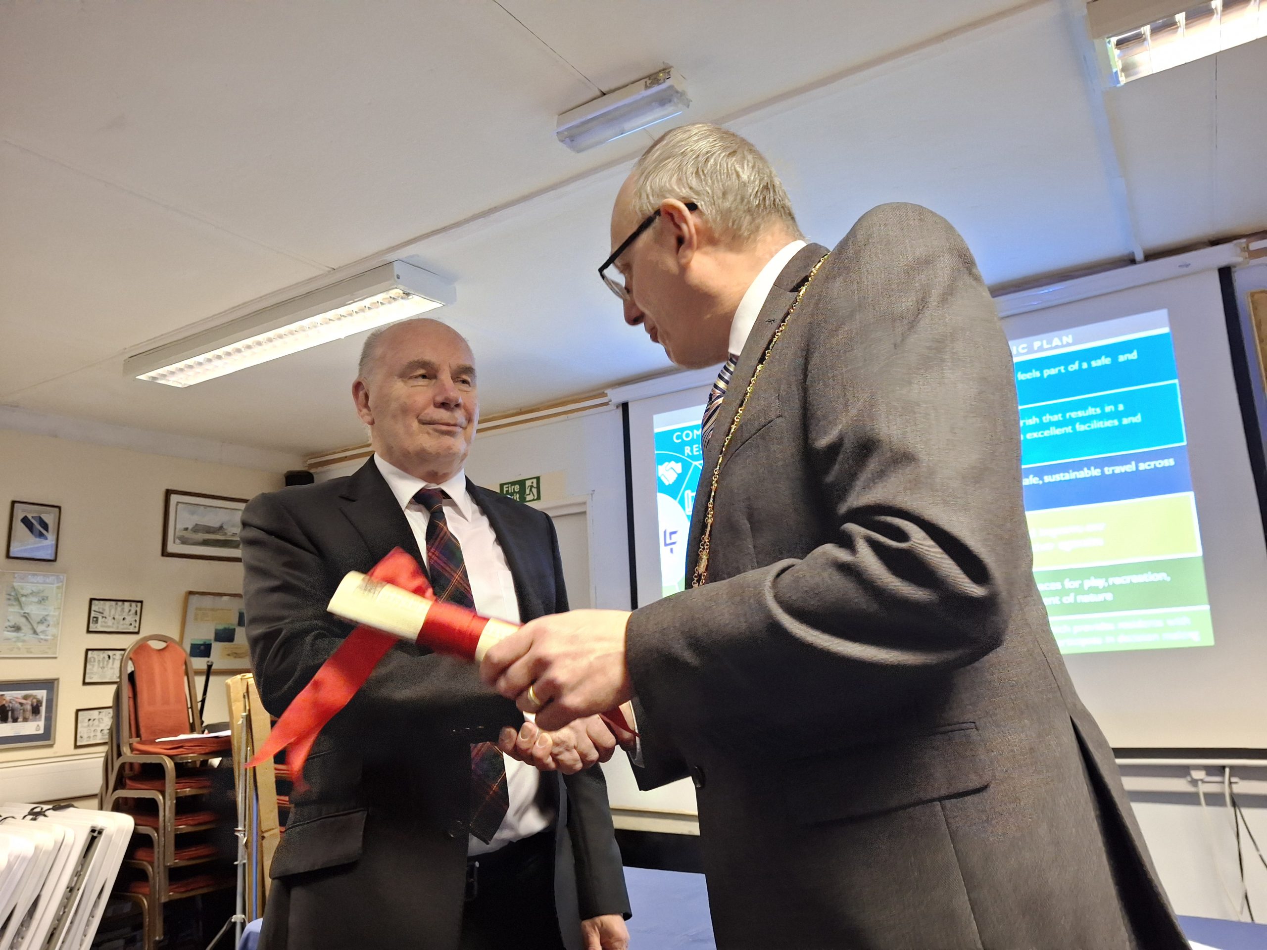 Chair of laverstock & Ford Parish Council presents Ian with the 'Freedom of the Parish'